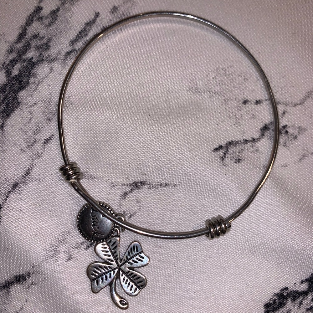 Clover silver bangle with “luck” charm